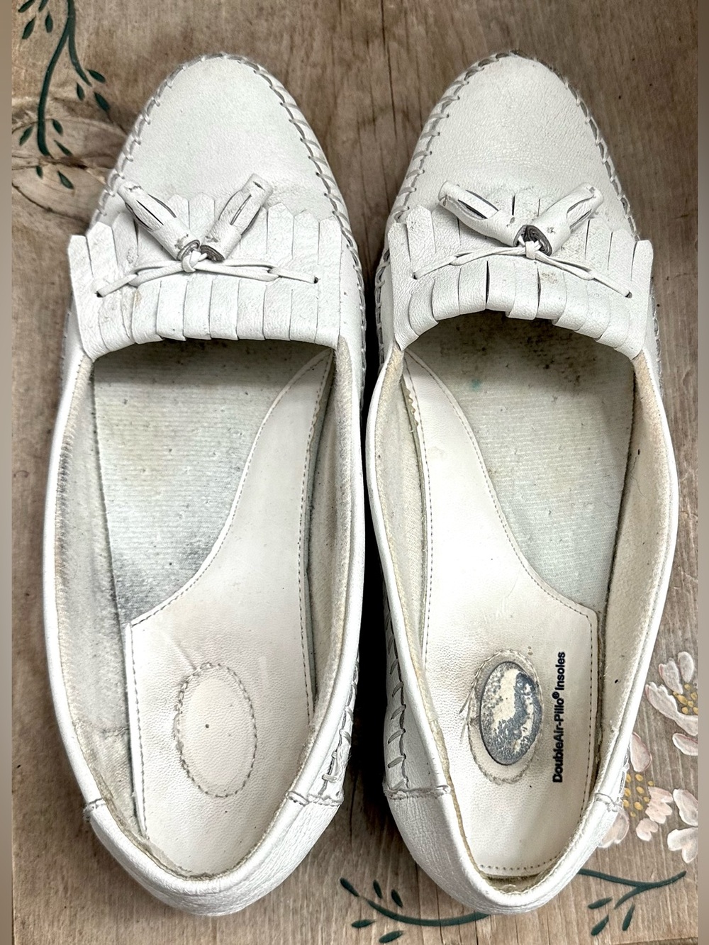 Scholl's white leather tassel moccasin flats, featuring a distinctive kiltie fri